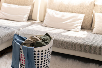 clothes in the basket before fold in living room at home