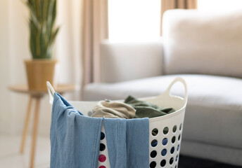 clothes in the basket before fold in living room at home
