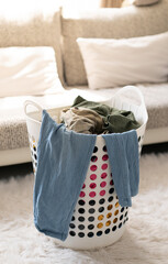 clothes in the basket before fold in living room at home