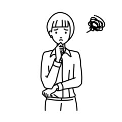 立って手をあごにあてて困っているオフィスカジュアルの女性