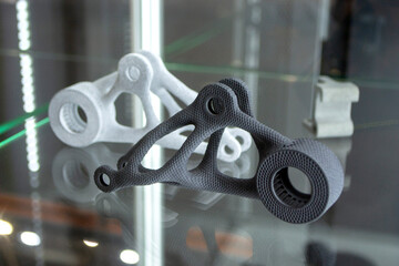 Black model detail printed on 3d printer from powder polyamide close-up. 3D prototype created by...