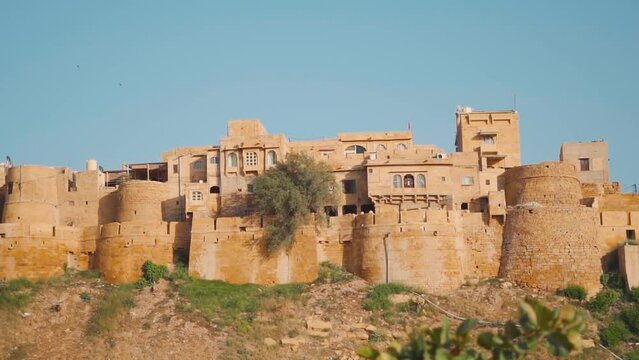Closeup shot of the fort wall with buildings at Jaisalmer Fort in Jaisalmer, Rajasthan, India. Houses inside the fort wall. Fort in the desert of Jaisalmer.