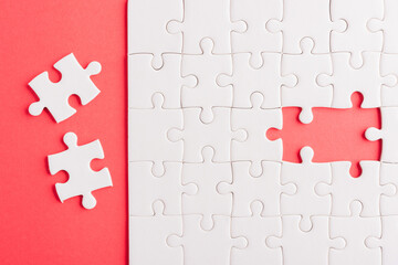 Top view flat lay of paper plain white jigsaw puzzle game texture last pieces for solve and place,...