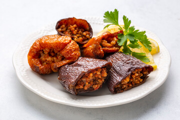 Dried eggplant stuffed and dried pepper stuffed with rice, tomato and olive oil known as dolma. (Turkish name; kuru biber dolmasi, kuru patlican dolmasi)