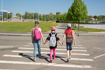 Schoolchildren crossing the road on their way to school