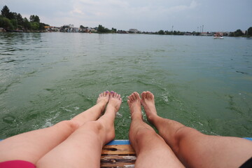 view of feet in water on vacation