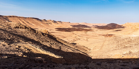 panorama of the Karnei Ramon and Mount Arod on the west end of the Makhtesh Ramon from the Arod Overlook showing the beginning of the Ramon Stream