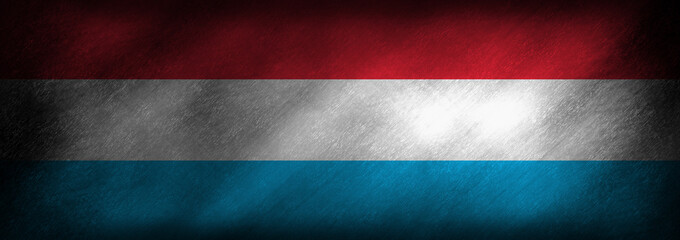 Flag of Luxemburg on an old looking background