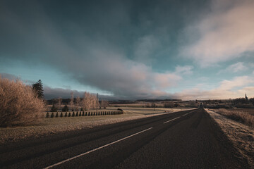 empty road on a cloudy day in winter