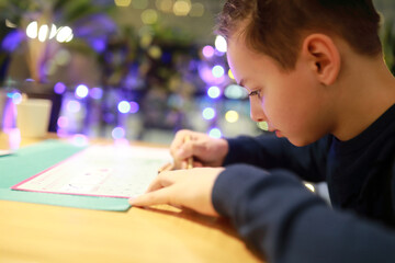 Child drawing in cafe