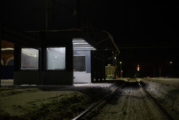 stop for passengers on the railway at night