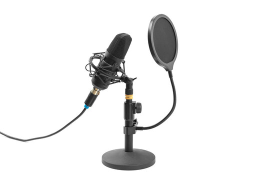 Close-up of a professional microphone with a pop filter in front of it. Desktop microphone for recording podcasts, songs and streaming on a stand against a light background