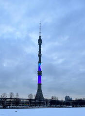 A TV tower in winter time. The Ostankino TV Tower. Moscow. Broadcast. Spire. Taper. Telecom. Cold. Winter season. Television. Steeple. Pivot. Telecommunication