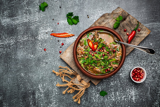 Georgian Kharcho lamb meat soup. Georgian dish chakapuli or the Turkish dish Alluciye. Keto diet dish. Georgian cuisine. banner, menu, recipe place for text, top view