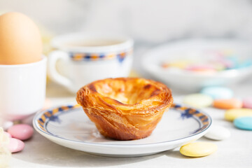 typical portuguese dessert pastel de nata and cup of coffee