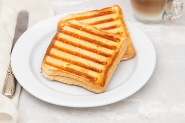 fresh breakfast toasts on white plate on ceramic