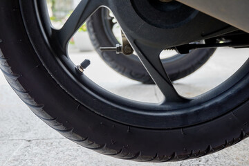 matic motorcycle wheels and black rims. tire valve cap