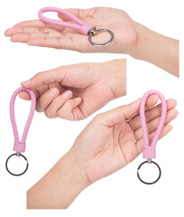 Set of hand holding Pink Leather Rope Keychain isolated on white background.
