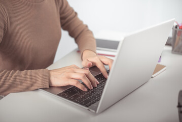 financial adviser working with calculator at office. accountant doing accounting and calculating revenue and budget. bookkeeper making calculation. finance and economy concept. online shopping.