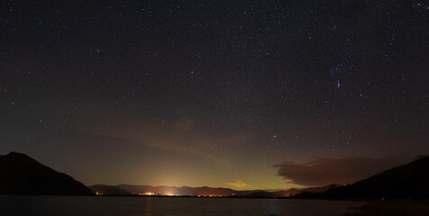 Fototapeta na wymiar A panoramic view of the night sky over Bassenthwaite in the English lake district