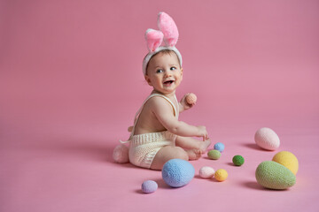 Obraz na płótnie Canvas Cute little baby wearing bunny costume looking away