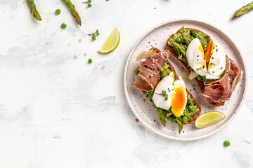 Ketogenic diet meal Poached egg with asparagus spears and prosciutto toast. banner, menu recipe...