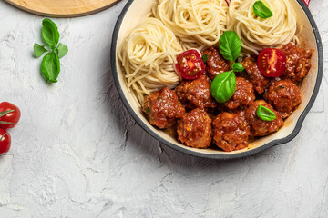 Pan with Italian pasta with tomato sauce and meatballs. Restaurant menu, dieting, cookbook recipe top view