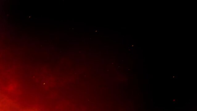 Seamless Loop Burning Red Hot Sparks, Fire Glowing Particles on Black Background. Fire Particles After Air Strike. Violent Explosion. Military 4k Stock Video Footage and B-Roll 