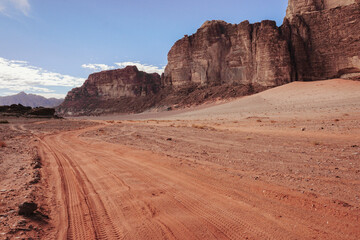 empty winding road in the wadi Rum desert beautiful relief mountains around, nature of Jordan