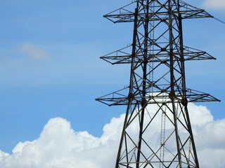 High voltage pole with blue sky background