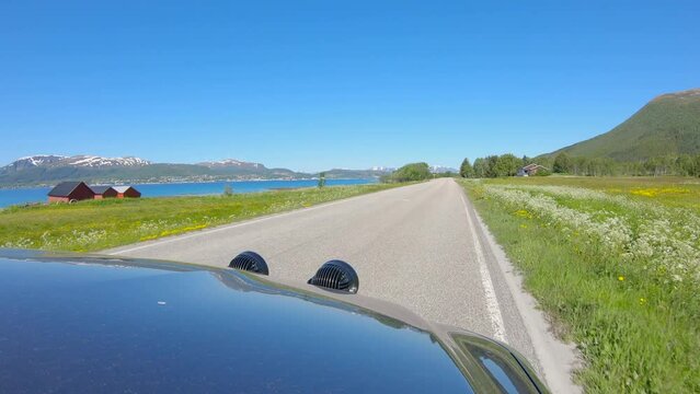 Driving car in Northern Norway, outside view, scenic landscape in Vesteralen, Slow Motion 60p
