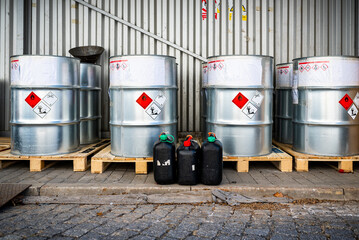Big metal barrels containing hazardous chemicals from laboratories, waste management concept,...