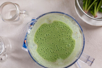 Preparation of detox smoothie from spinach and various fruits, healthy food