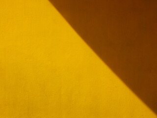 street yellow wall with shadow background