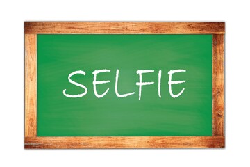 SELFIE text written on green school board.