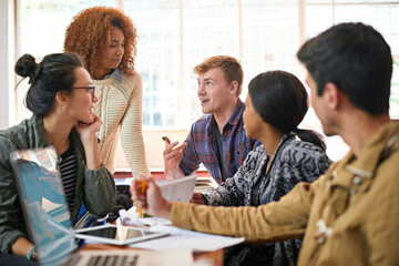 Explaining some of the class notes. Shot of students hanging out together between class.