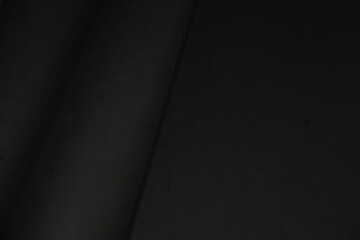 dark texture from black paper gradient use as wallpaper, banner, background, no word. 