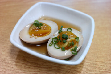 Egg paste made with soy sauce on a square plate.