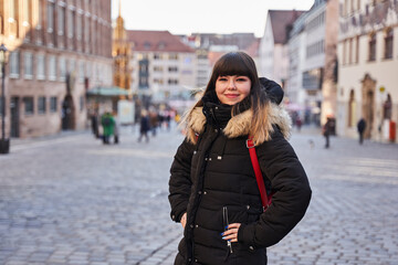 Obraz premium Urban portrait of a woman in winter coat