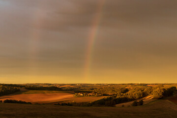 Naklejka na ściany i meble Double arc en ciel sur la campagne gersoise au lever du soleil en automne