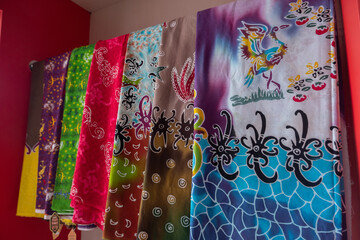 Various types of batik from Bontang, East Kalimantan, Indonesia, with a silver egret and mangrove motif, in Indonesian it is called batik kuntul perak