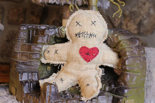 Spooky voodoo doll in traditional Halloween decoration