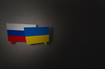 Background with Ukrainian and Russian flags. Concept for the peace talks and negotiations. Russia vs Ukraine war. Stop war.