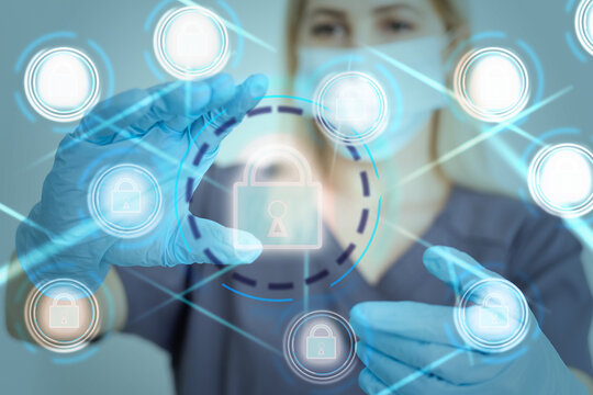 Unrecognizable doctor of medicine securing patient medical records across multiple devices via a computer network. Healthcare IT concept for security of health information exchange and data privacy.