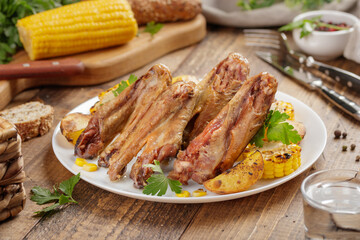 Duck/ chicken baked wings with vegetables and corn