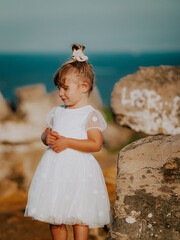 portrait of a little girl on the beach in portugal algarve 