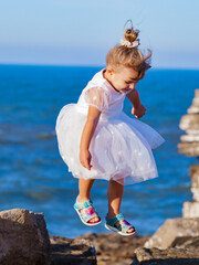 portrait of a little girl on the beach in portugal algarve 