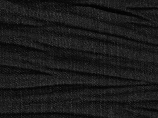 Fototapeta premium crumpled black jean texture background