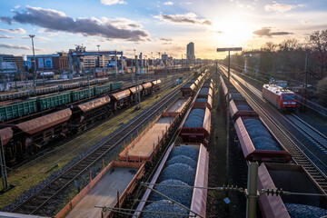Fototapeta na wymiar Coal Transport with view on european central bank at sun down