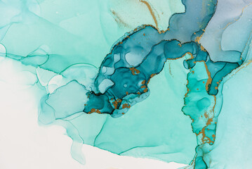 Abstract alcohol ink fluid art background in blue and green